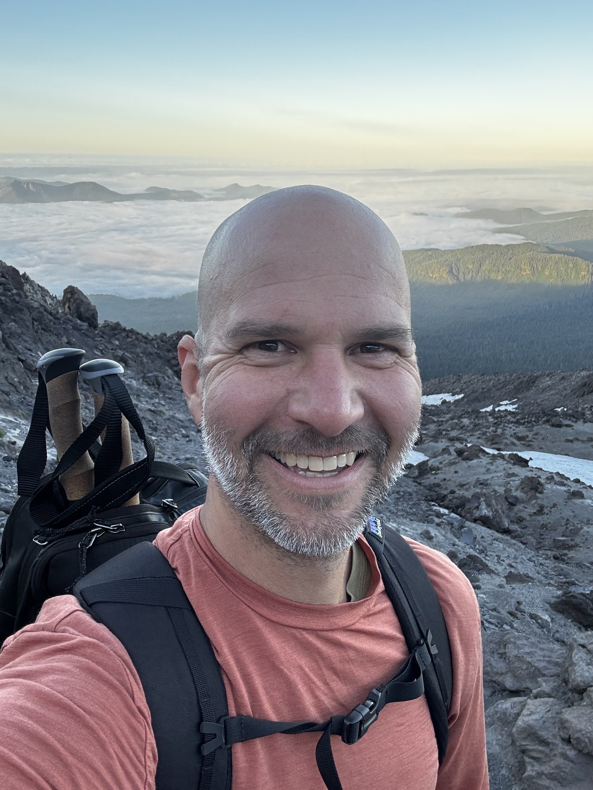 Brad Korpalski on a summit above the clouds