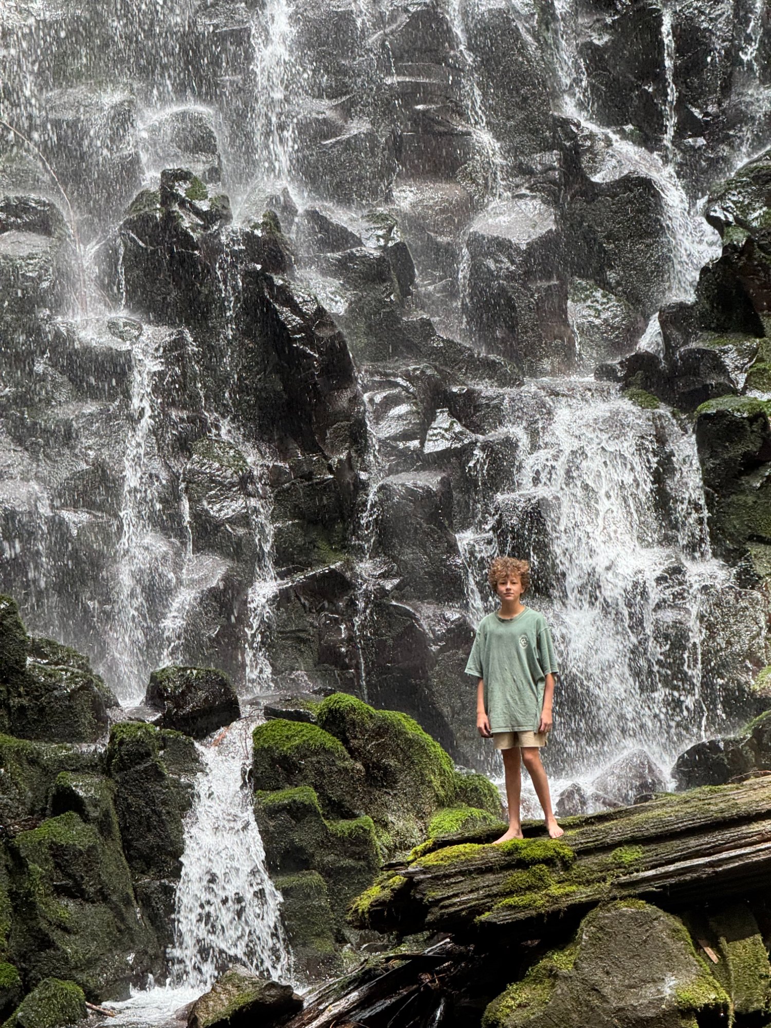 Boy at waterfall